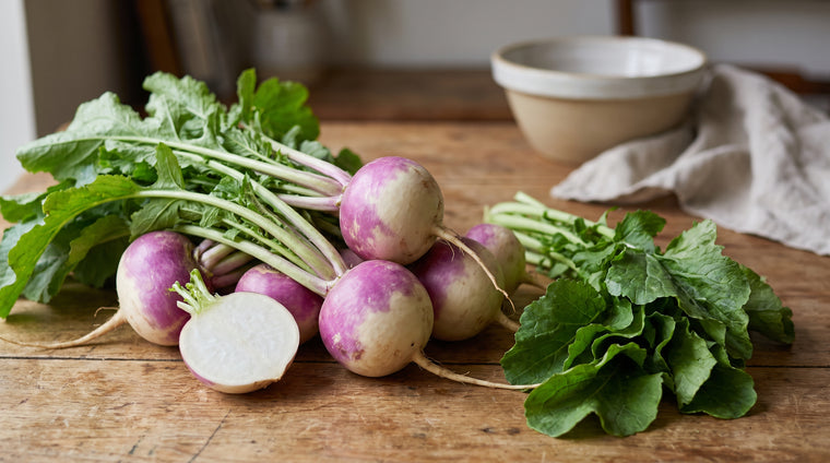 Fresh turnips and their peppery greens, two crops in one.