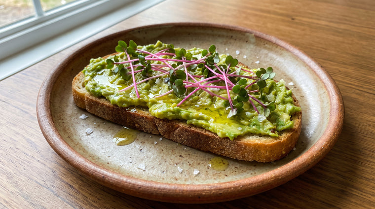 A handful of spicy radish microgreens over avocado toast.